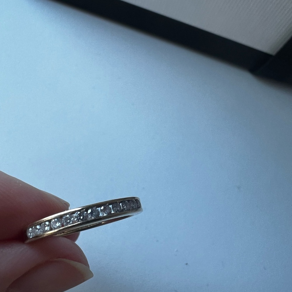 Gold Ring with Multiple Diamonds Set in Band
